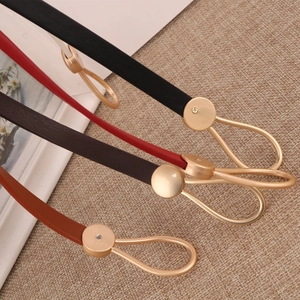 Slim faux leather waist belts in black, red, and brown with gold round metal buckles