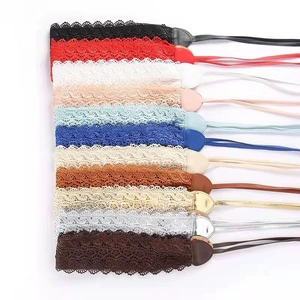 Flat lay macro shot of lace corsage belts in twelve vibrant colors for women
