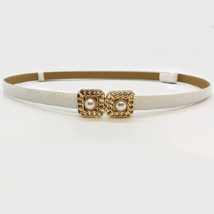 Detail of white PU leather belt with golden interlocking buckles and faux pearls