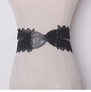 Detailed view of women's vintage black lace corset belt with faux leather center bow design