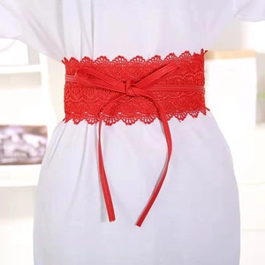 Detail of red floral lace waist cincher with a delicate faux leather bow tie decoration