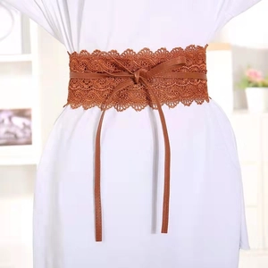 Caramel lace corset belt with intricate crochet floral patterns and bow tie-up closure