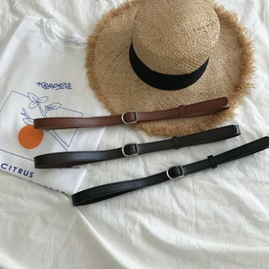 Three minimalist slim PU leather belts in brown, dark coffee, and black with silver buckles
