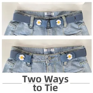 Detail showing two ways to wear the blue daisy elastic no-buckle belt on denim shorts