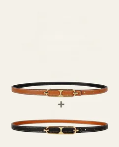 Detail of double-sided leather belt showing brown Epsom texture and black smooth leather