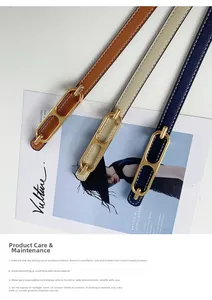 Detailed view of three slim leather belts in brown, beige and navy with gold oval buckles