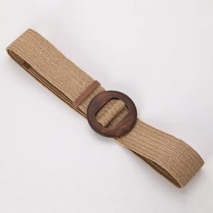 Close-up of bohemian woven belt with natural khaki texture and round wooden buckle