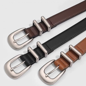 Three vintage minimalist leather belts with matte silver buckles in brown and black
