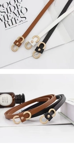 Détail de fines ceintures en cuir avec boucles dorées infinity pour robes de femmes