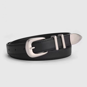 Detail of vintage black leather belt showing silver metal buckle and decorative tip hardware