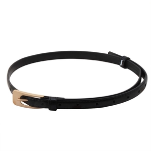 Minimalist black leather belt for women with elegant golden metal buckle on white background