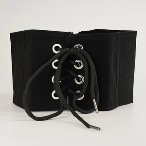 Vintage black corset belt with silver metal eyelets and lace-up front for dresses