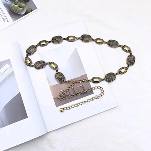 Vintage gold metal waist chain with textured oval links and smooth rectangular accents
