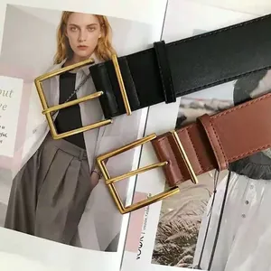 Minimalist black and brown women's belts with elegant polished gold rectangle buckles