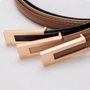 Slim women's leather belts in black and khaki with elegant rectangular metal buckles