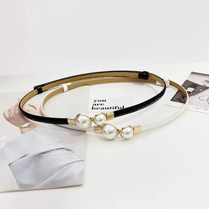Elegant patent leather skinny belts in black and white with gold double pearl buckles