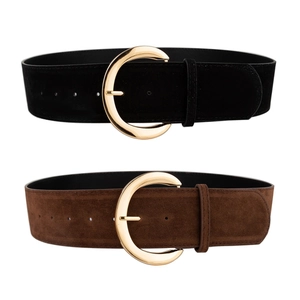 Detail of vintage suede wide belts with large crescent gold buckles in black and dark brown