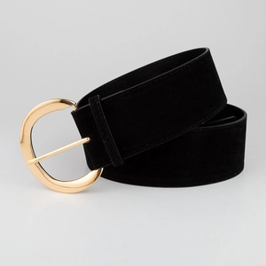 Detail of black suede waist belt for women featuring a gold crescent metal buckle