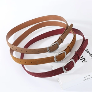 Three suede slim belts in brown, caramel, and burgundy with vintage silver buckles