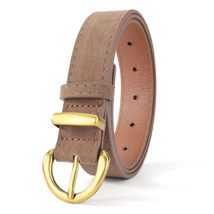 Close-up of brown faux suede belt with vintage golden D-ring buckle and precise stitching