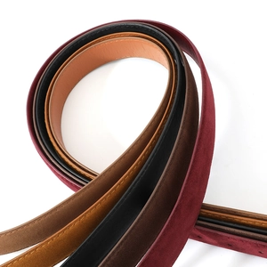 Collection of retro suede and leather belts in burgundy, black, and brown for women