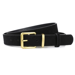 Detail of the vintage matte black suede belt with a polished gold square buckle