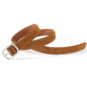 Detail view of brown suede leather belt with vintage silver buckle and fine stitching