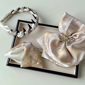 Elegant floral fabric hair claw and headband set with silk texture and pearls