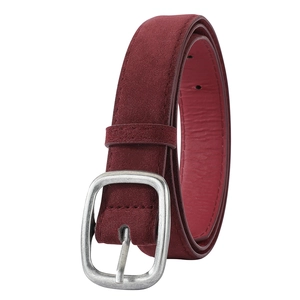 Macro shot of vintage dark red suede leather belt with brushed silver matte metal buckle