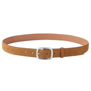 Close-up of brown suede belt with vintage silver buckle and smooth nude leather lining