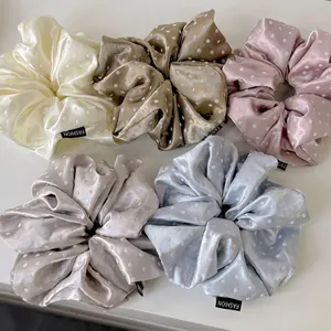 Set of 5 polka dot satin scrunchies in pastel colors with fashion labels for women