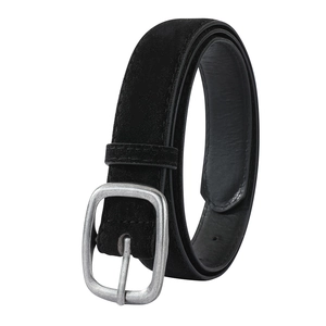Detail of vintage silver metal buckle and black suede texture on a chic women belt