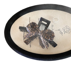 Molla per capelli retrò con fiocco leopardato per donna per uno stile sofisticato