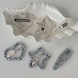 6-piece set of luxury crystal star and heart hair clips in blue and clear tones