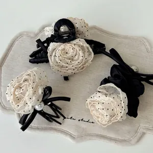 French polka dot flower hair claw set with black satin bow and pearl accents