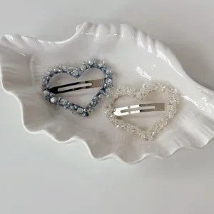 Luxurious crystal heart hair clips with light blue and clear beads on silver base