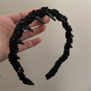 Punk style black beaded headband with long spikes and sequins for high skull top look