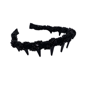Elegant wavy beaded headband with black sequins and punk style studs in a high crown design