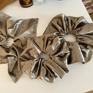 Three-piece champagne satin scrunchie set with black polka dots and elegant streamers