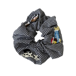 Cute black and white gingham scrunchie with embroidered puppy patches for hair styling