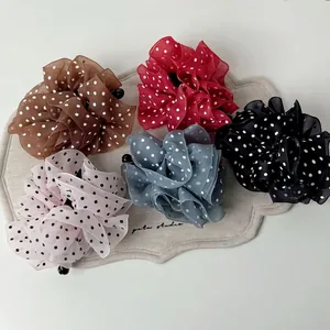 Set of five elegant mesh polka dot hair clips in various colors for women's hairstyling