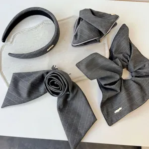 Elegant grey striped fabric hair accessory set including headband and shark clips