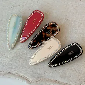 Elegant teardrop hair clips set with rhinestones and colorful acetate finish