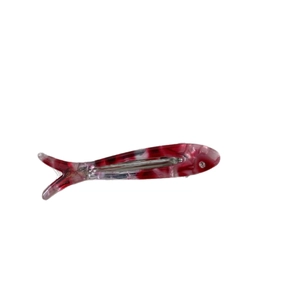 Red marble acetate fish-shaped hair clip with sparkling rhinestone eye and metal grip