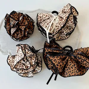 Elegant leopard print oversized hair clips and scrunchies set with ribbon details