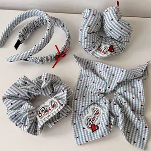 Blue gingham hair accessory set with red hearts including scrunchies and headband