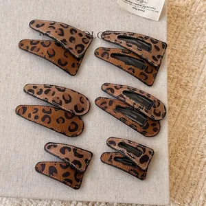 Vintage leopard print leather hair clips set in rectangle, oval and triangle shapes