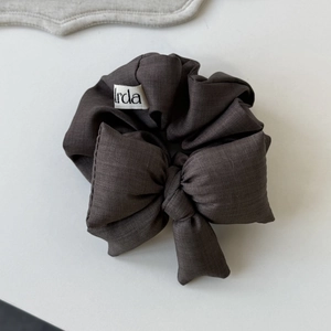 Deep coffee brown bow hair scrunchie with twill fabric texture and branded irda tag
