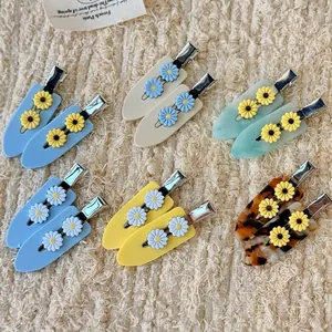 Coffret de barrettes à cheveux marguerite en acétate avec motifs floraux