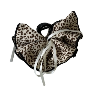 Retro leopard print bow hair claw clip with white ribbon detail on white background